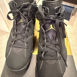 Jordan Black and Gold Sneakers